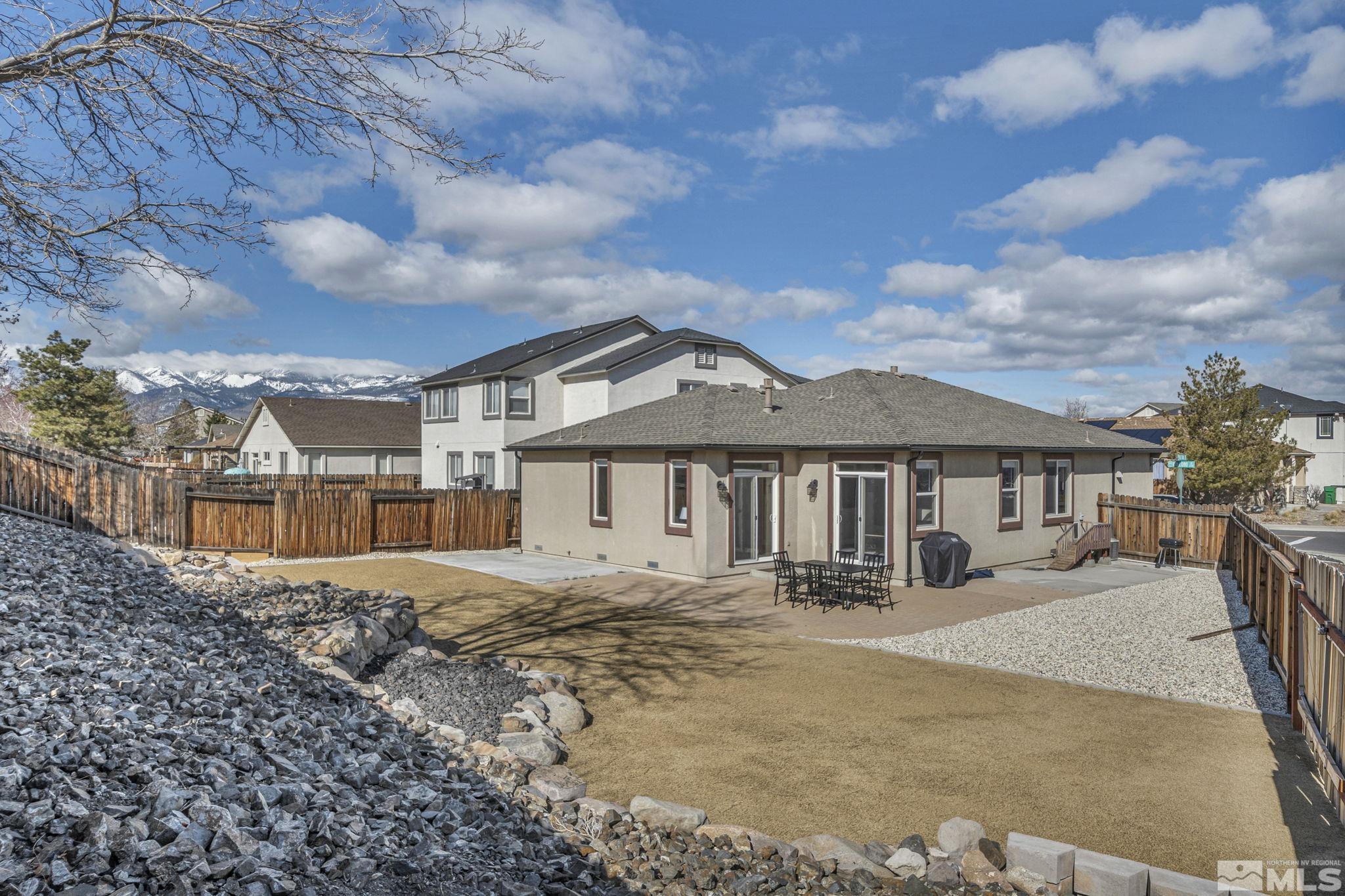 2296 Rio Lobo Lane Reno, NV 89521 - Photo 31 of 33 a front view of a house with yard and seating