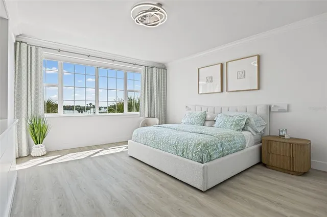 a living room with a bed and a window