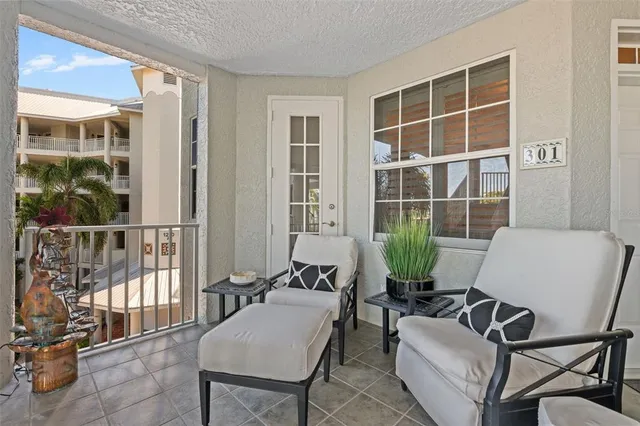 a living room with furniture and windows