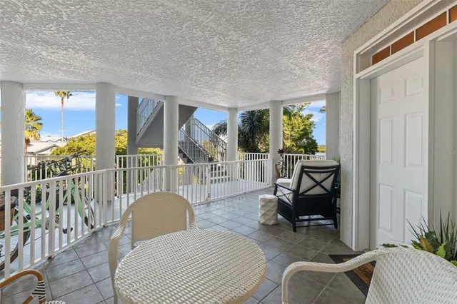 a living room with furniture fireplace and a large window