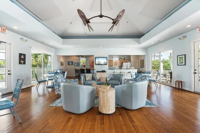 a view of a dining room with furniture and wooden floor
