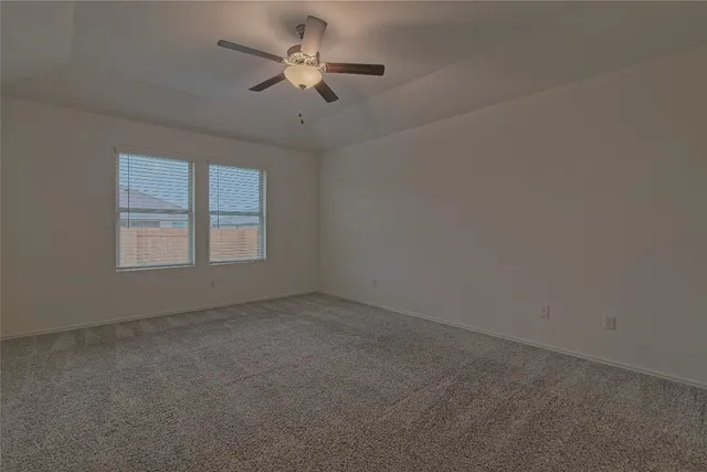 a bedroom with a bed and a table