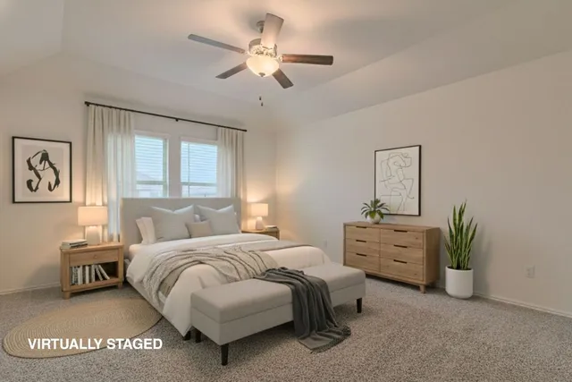 an empty room with a chandelier fan and windows