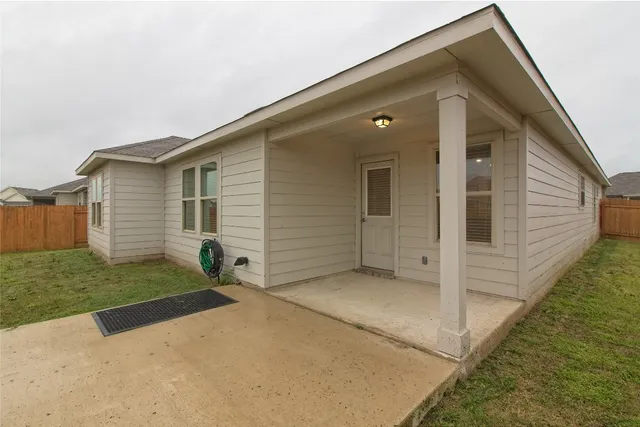 a view of a lake with houses in the back