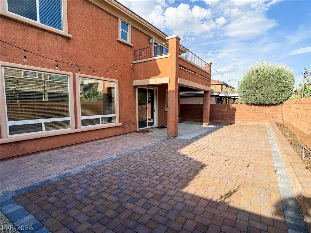 8683 Moreno Mountain Avenue Las Vegas, NV 89178 - Photo 23 of 26 Brick pavers define this outdoor living space, perfect for al fresco gatherings under an open sky.