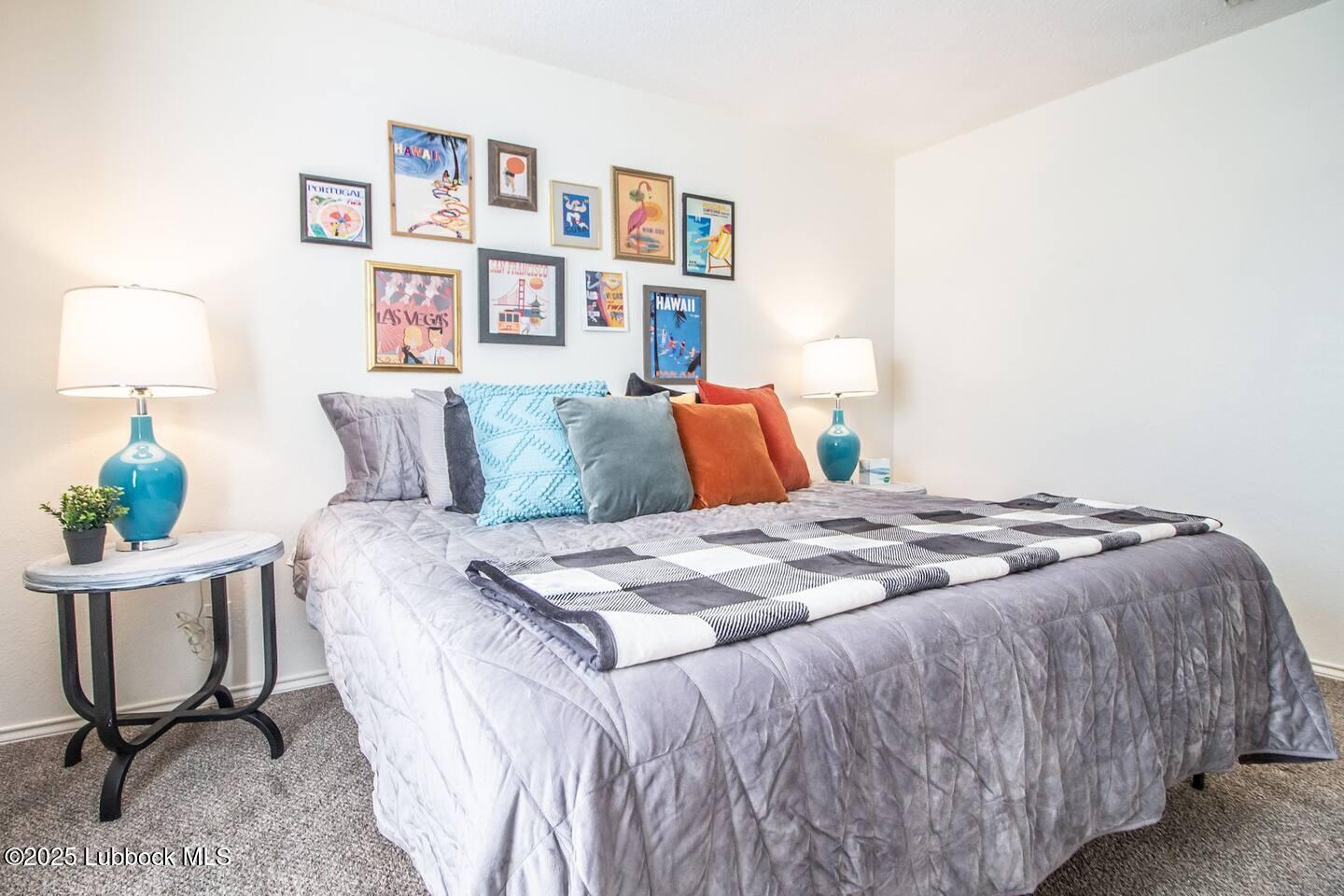 5806 6th Street, Unit B Lubbock, TX 79416 - Photo 13 of 45 a bedroom with a bed and a chair