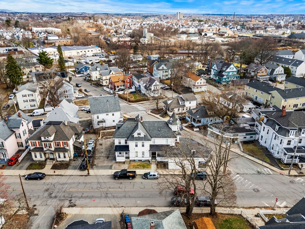 an aerial view of residential houses with outdoor space
