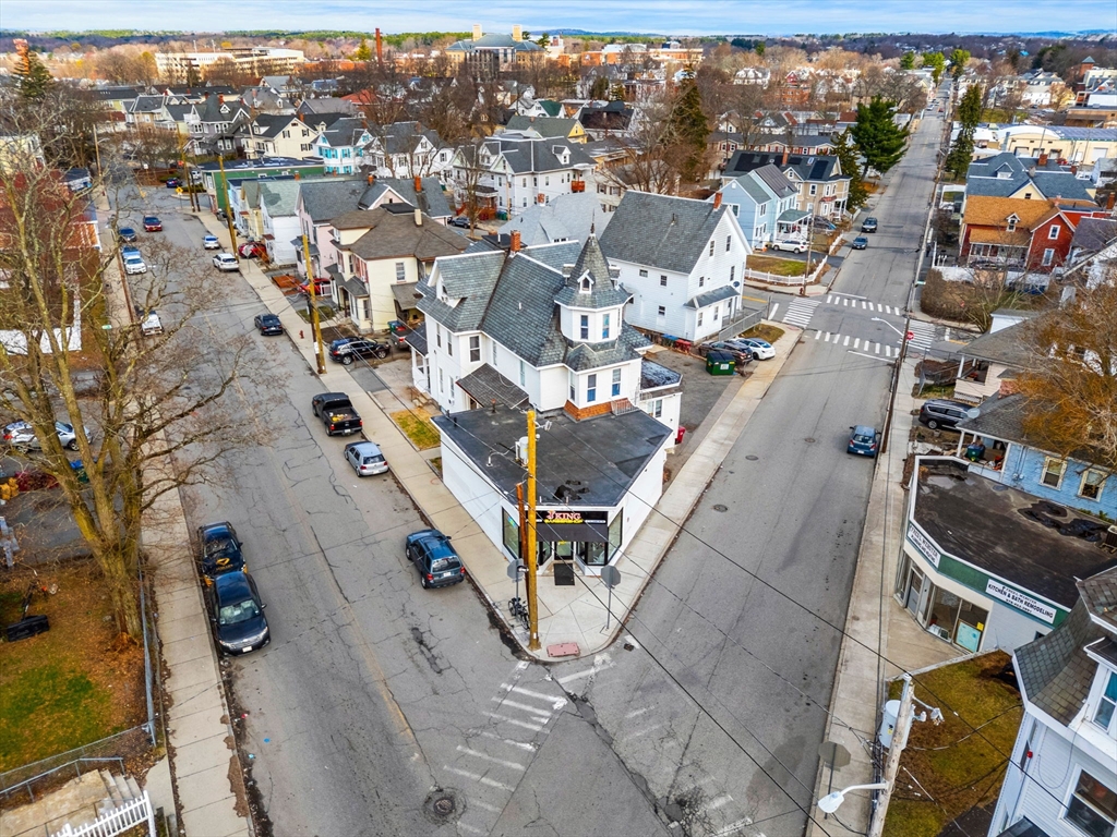 237 Branch Street Lowell, MA 01851 - Photo 4 of 15 an aerial view of a city with lots of residential buildings