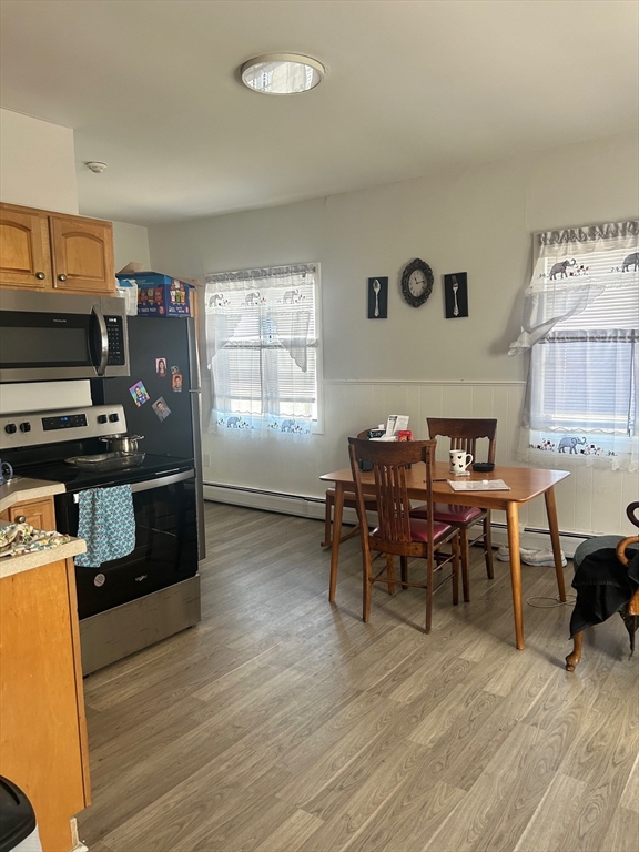 237 Branch Street Lowell, MA 01851 - Photo 7 of 15 a view of a dining room with furniture and window