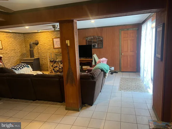 a bedroom with a bed cabinets and window