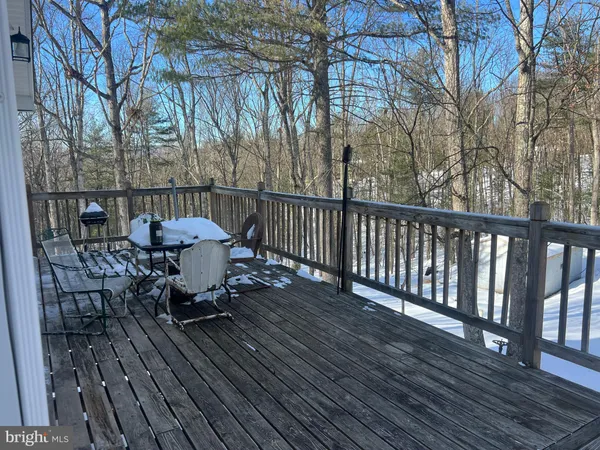 a view of a dining room with furniture and a window