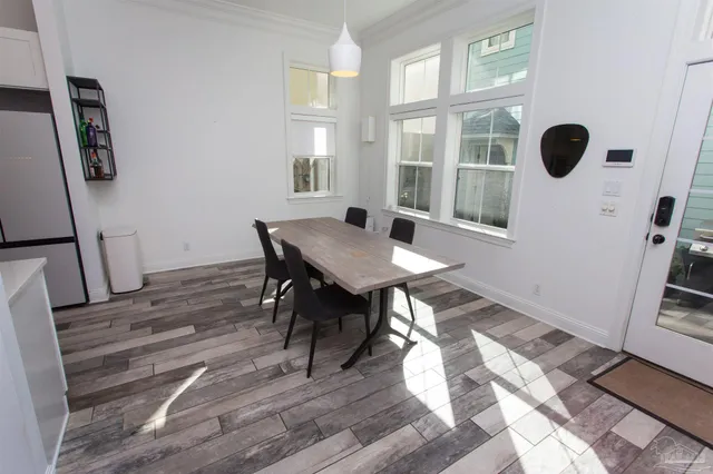 a white toilet sitting next to a window