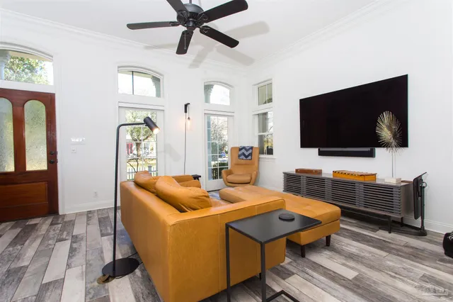 a view of a dining room with furniture window and wooden floor