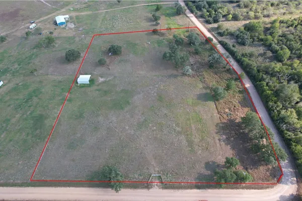 a view of backyard with green space