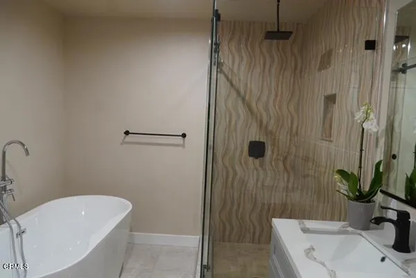 a bathroom with a double vanity sink toilet and mirror