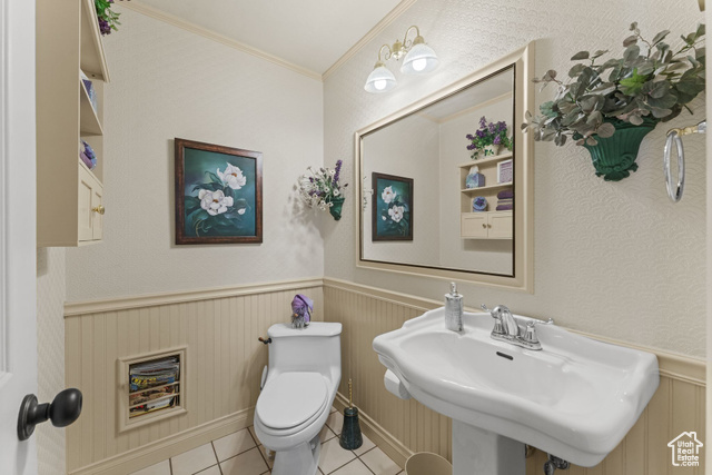 6407 North Dry Frk Cyn Road West Vernal, UT 84078 - Photo 28 of 48 Bathroom with tile patterned flooring, toilet, wainscoting, a sink, and crown molding