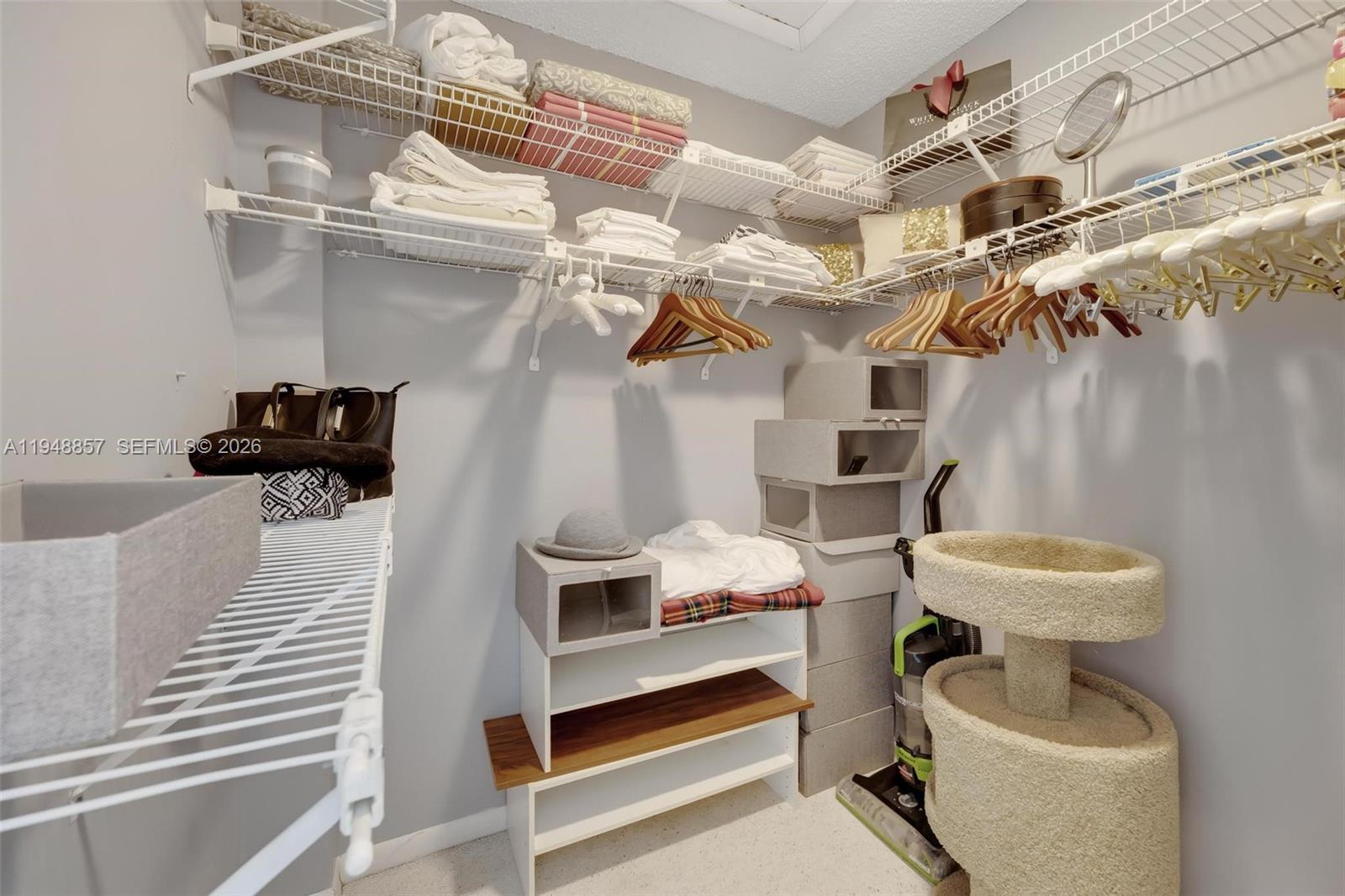 11769 Southwest 91st Terrace Miami, FL 33186 - Photo 19 of 33 a view of walk in closet with clothes and shoes