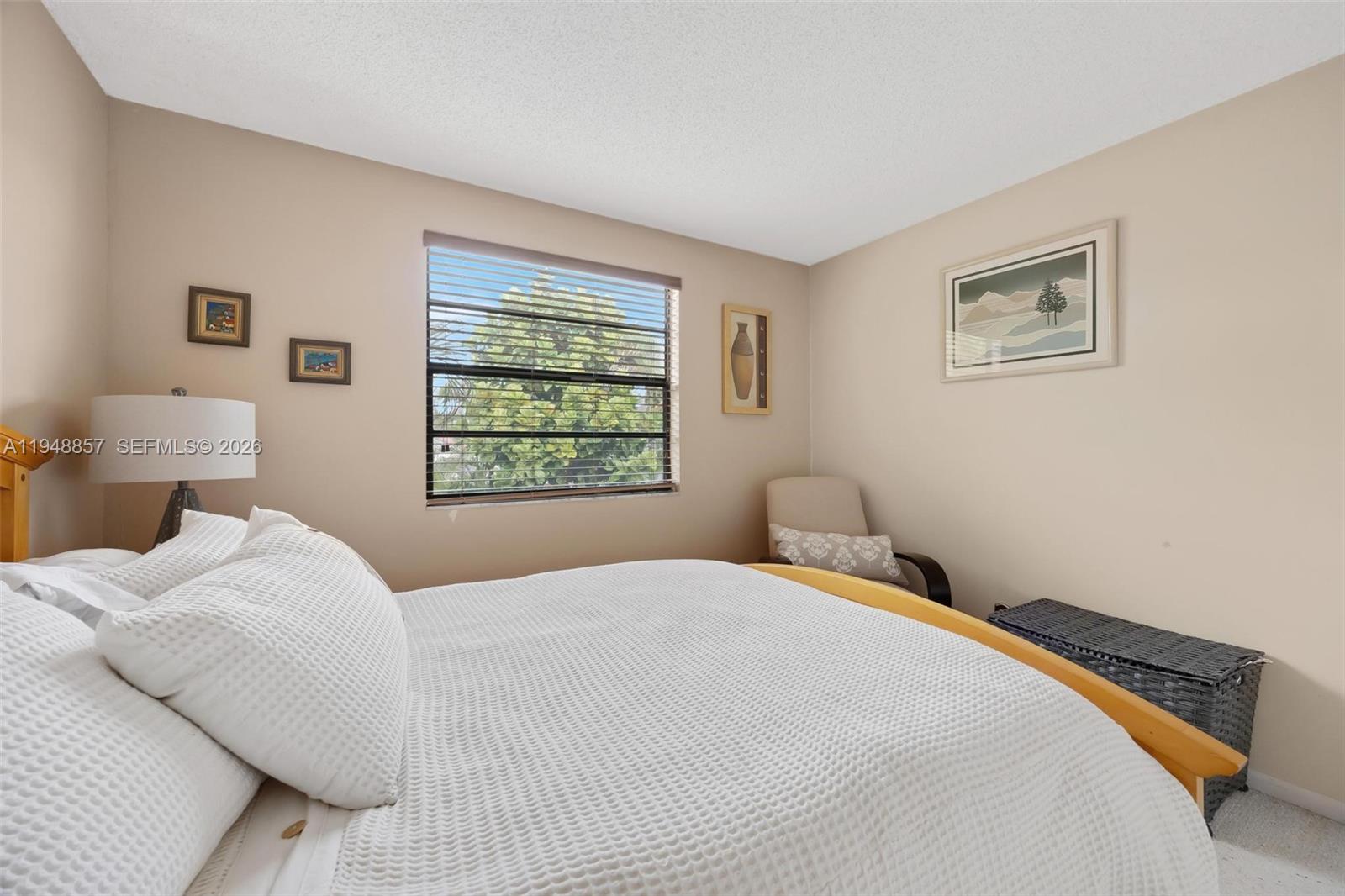 11769 Southwest 91st Terrace Miami, FL 33186 - Photo 21 of 33 a bedroom with a bed and a window