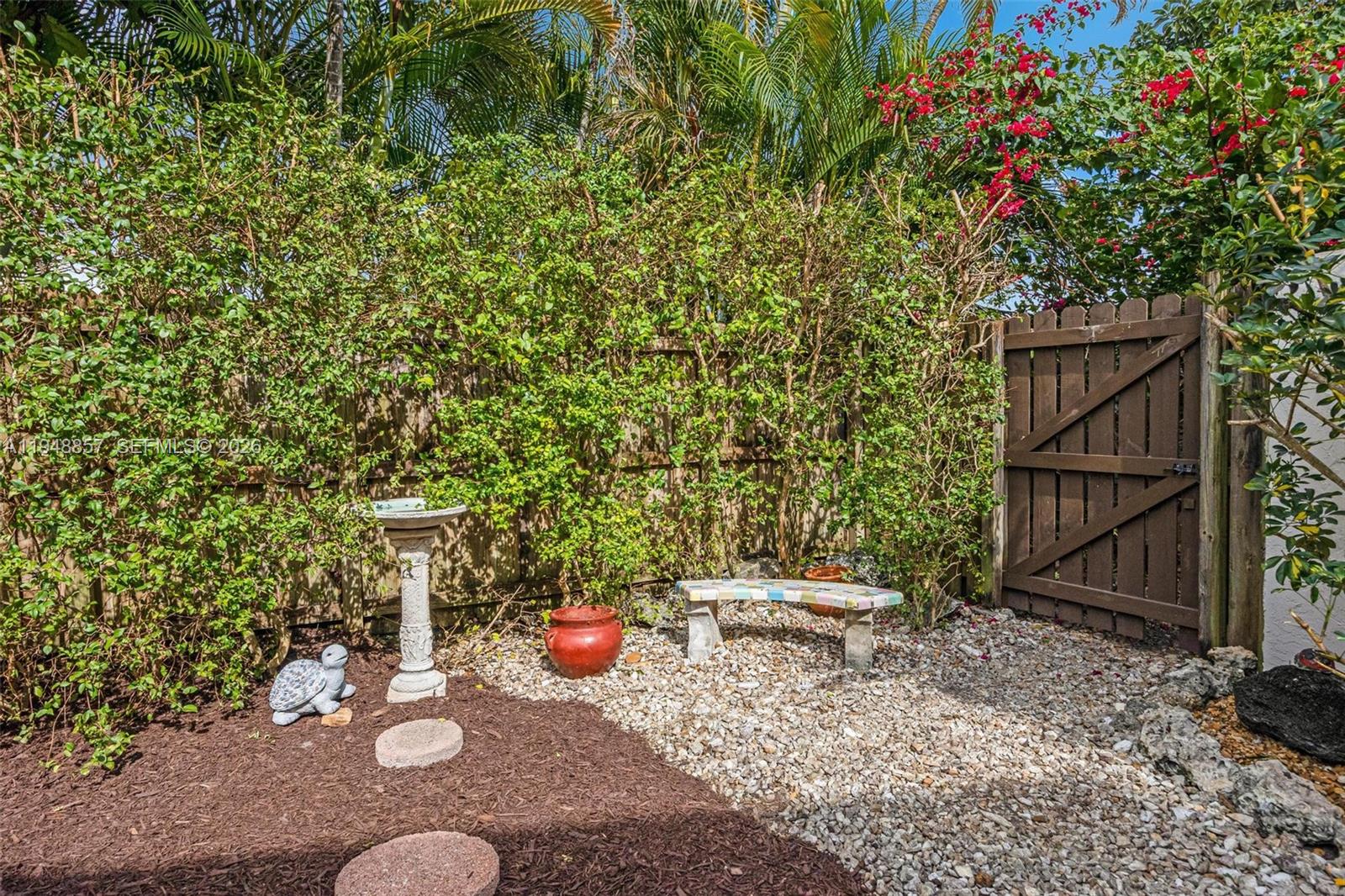 11769 Southwest 91st Terrace Miami, FL 33186 - Photo 25 of 33 a view of a chair and table in backyard