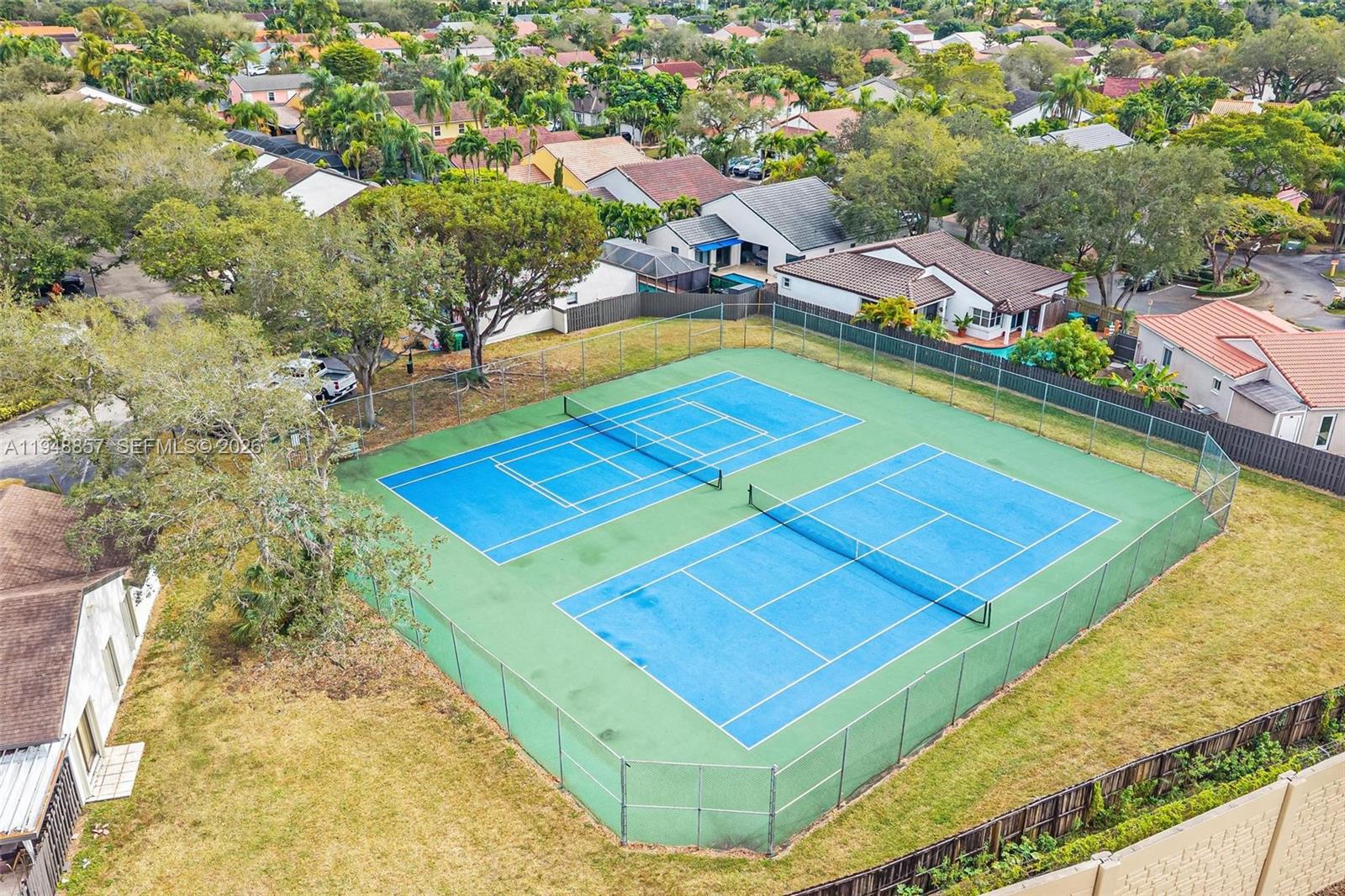 11769 Southwest 91st Terrace Miami, FL 33186 - Photo 31 of 33 an aerial view of residential houses with yard and swimming pool