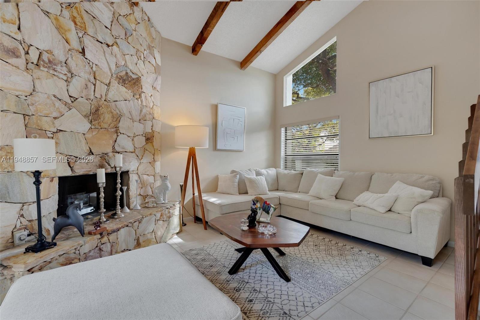 11769 Southwest 91st Terrace Miami, FL 33186 - Photo 5 of 33 a living room with furniture and a fireplace