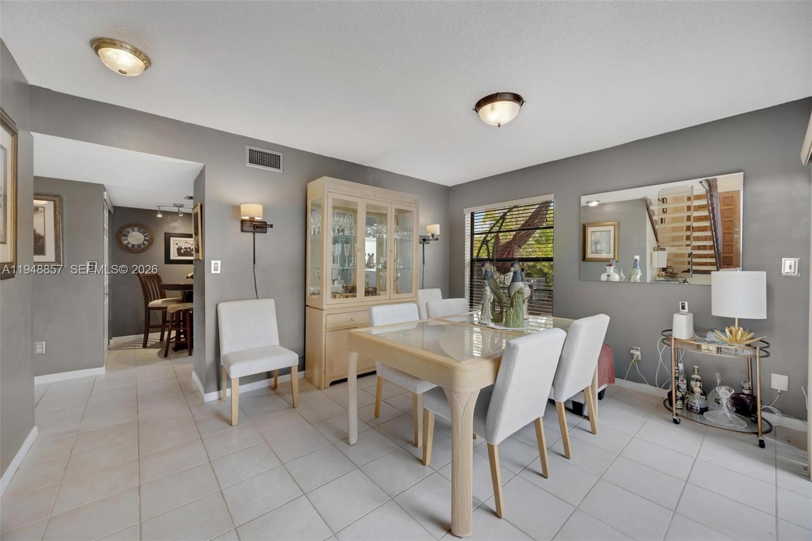 11769 Southwest 91st Terrace Miami, FL 33186 - Photo 6 of 33 a view of a livingroom with furniture and a dining table chair
