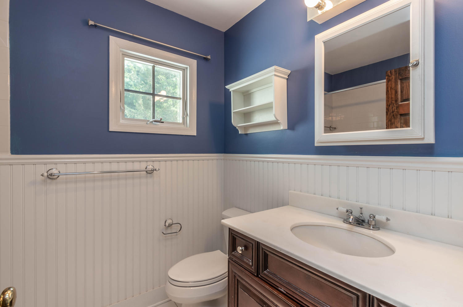 4 Moore Street Darien, CT 06820 - Photo 19 of 30 a bathroom with a granite countertop toilet sink and mirror