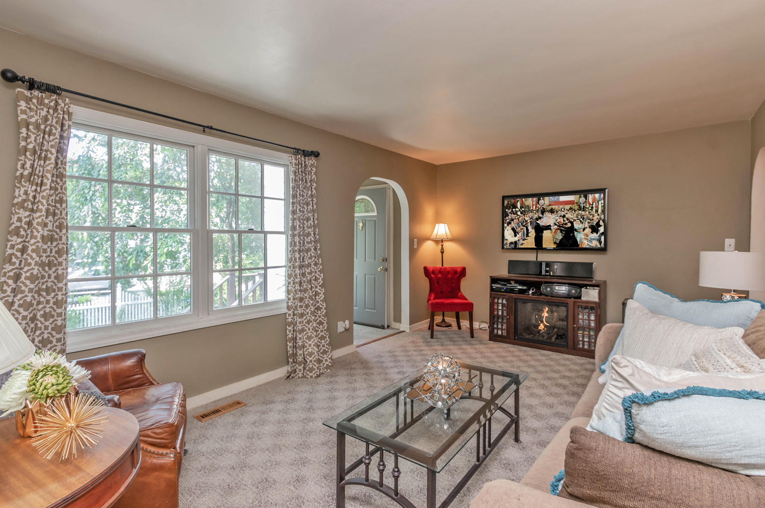 4 Moore Street Darien, CT 06820 - Photo 2 of 30 a living room with furniture and a large window