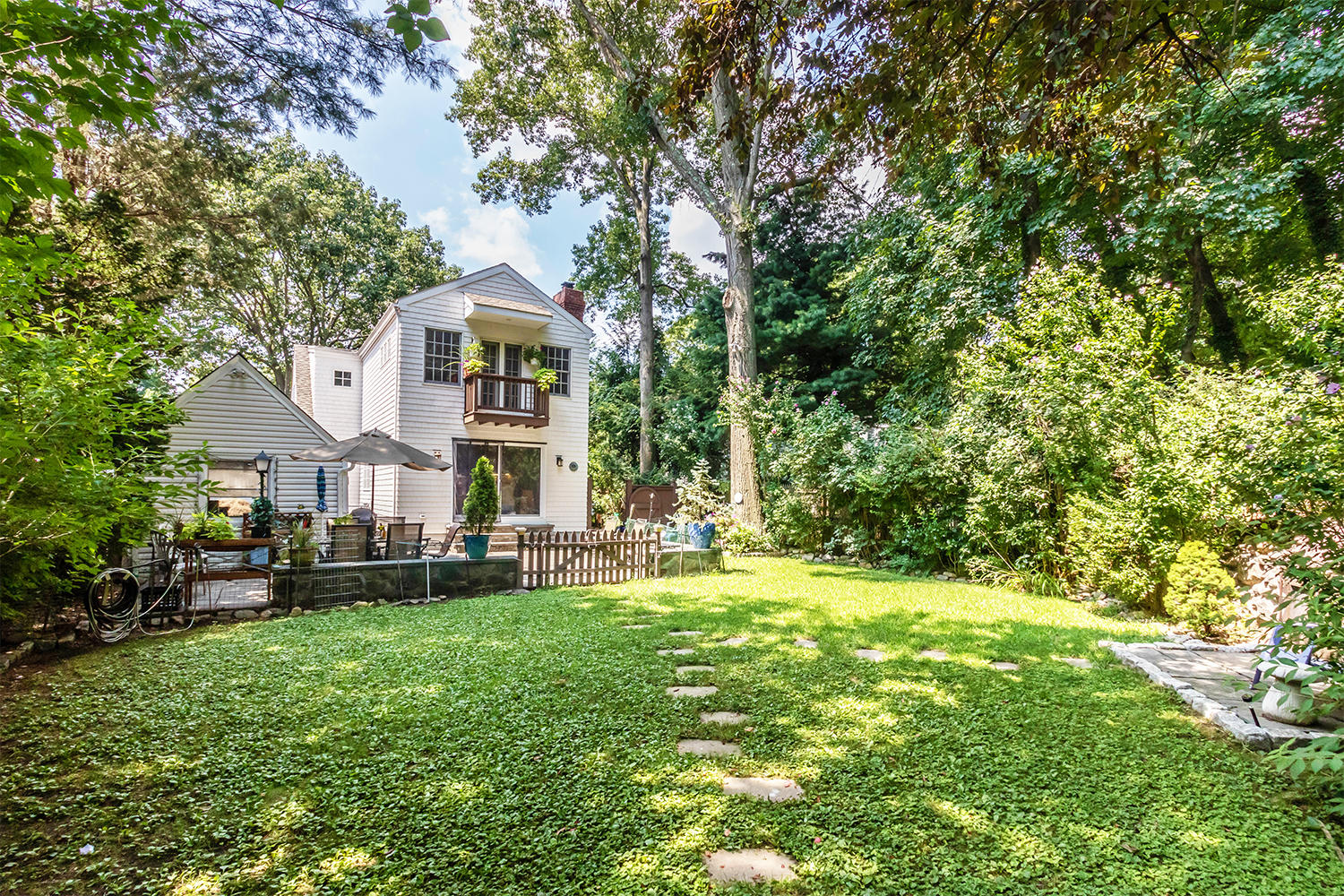 4 Moore Street Darien, CT 06820 - Photo 29 of 30 a view of a house with a big yard plants and large trees