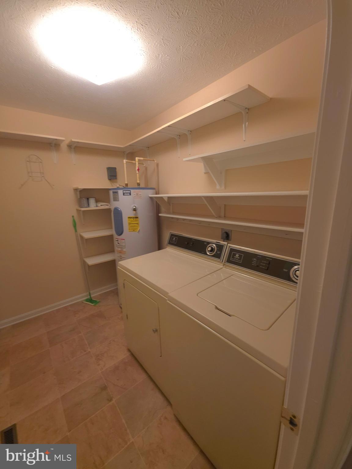 142 Braddock Boulevard Inwood, WV 25428 - Photo 13 of 36 a utility room with dryer and washer