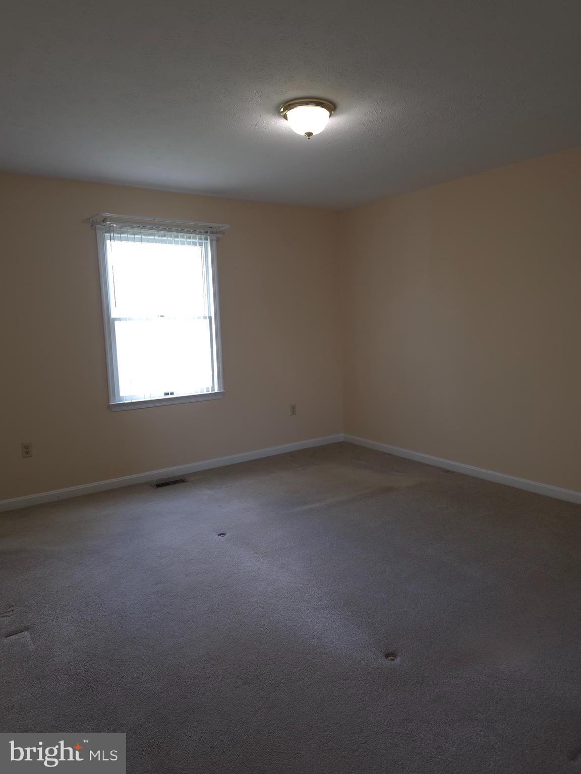 142 Braddock Boulevard Inwood, WV 25428 - Photo 24 of 36 an empty room with a window