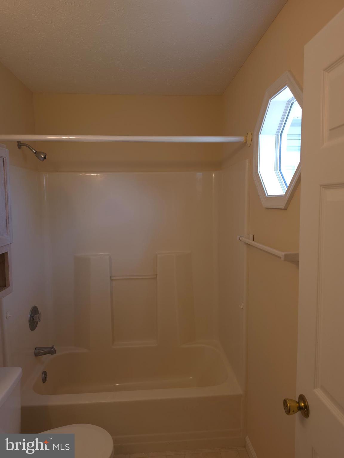 142 Braddock Boulevard Inwood, WV 25428 - Photo 25 of 36 a bathroom with a bathtub