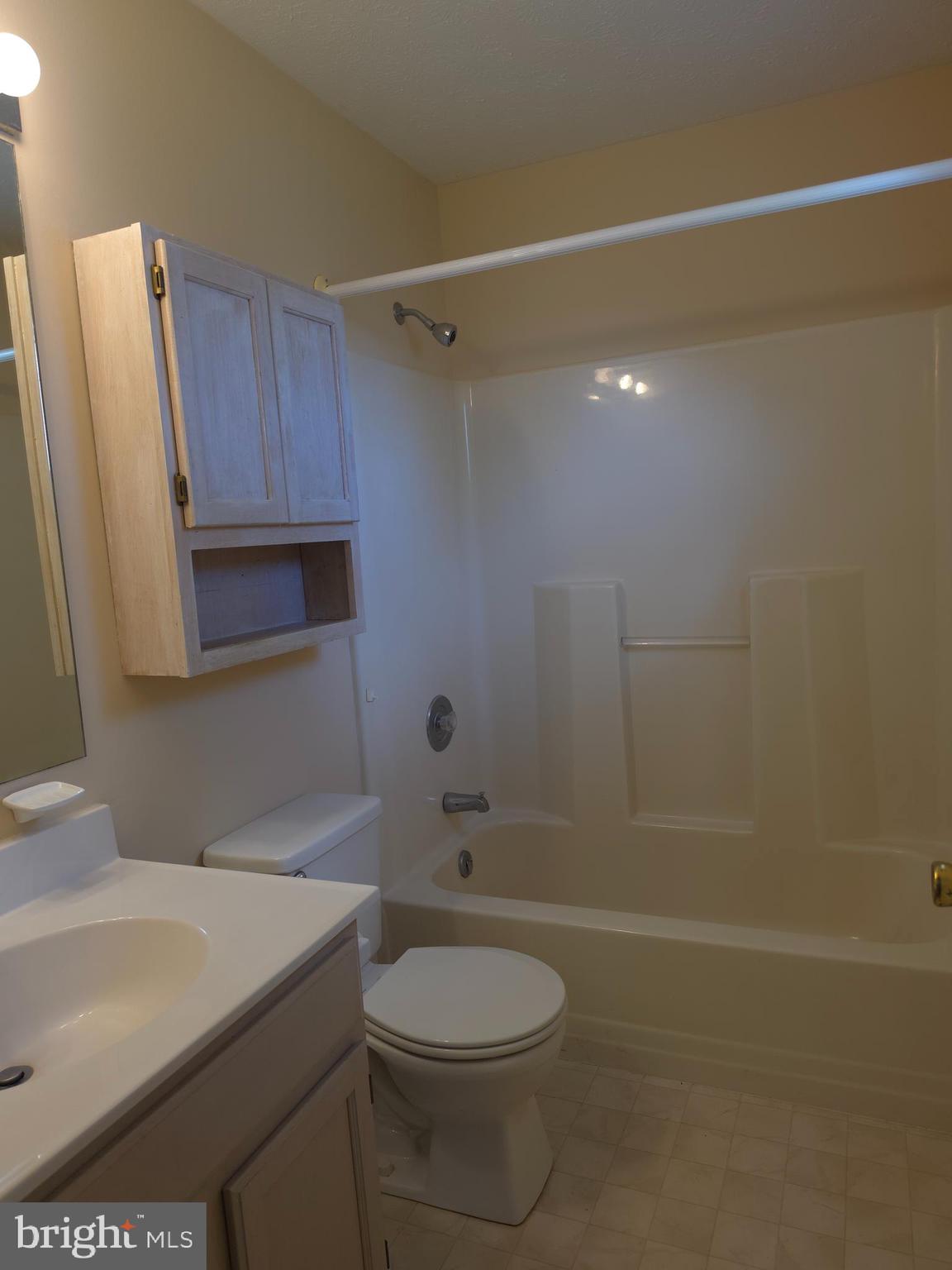 142 Braddock Boulevard Inwood, WV 25428 - Photo 26 of 36 a bathroom with a sink a toilet and shower