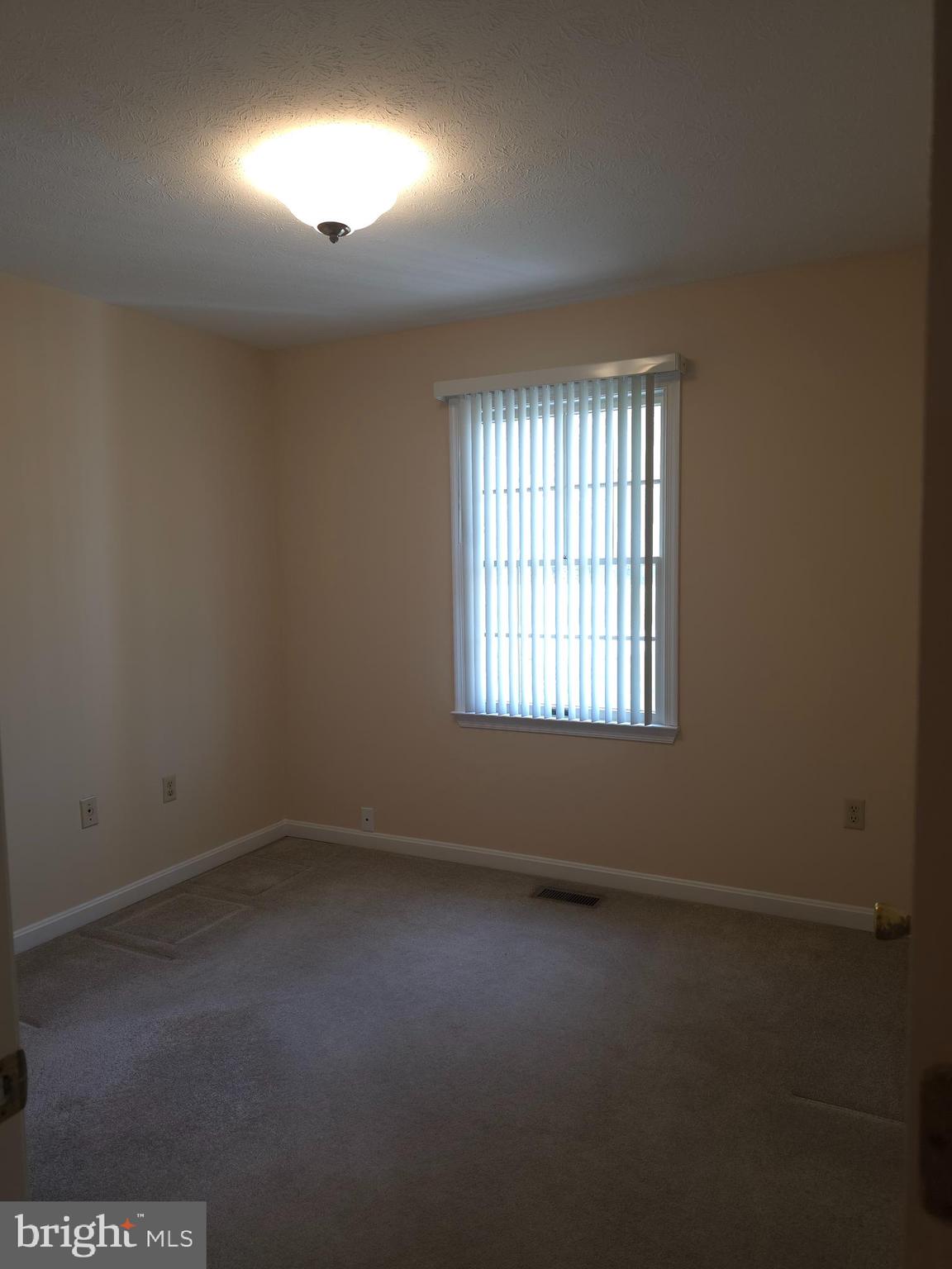 142 Braddock Boulevard Inwood, WV 25428 - Photo 29 of 36 an empty room with a window