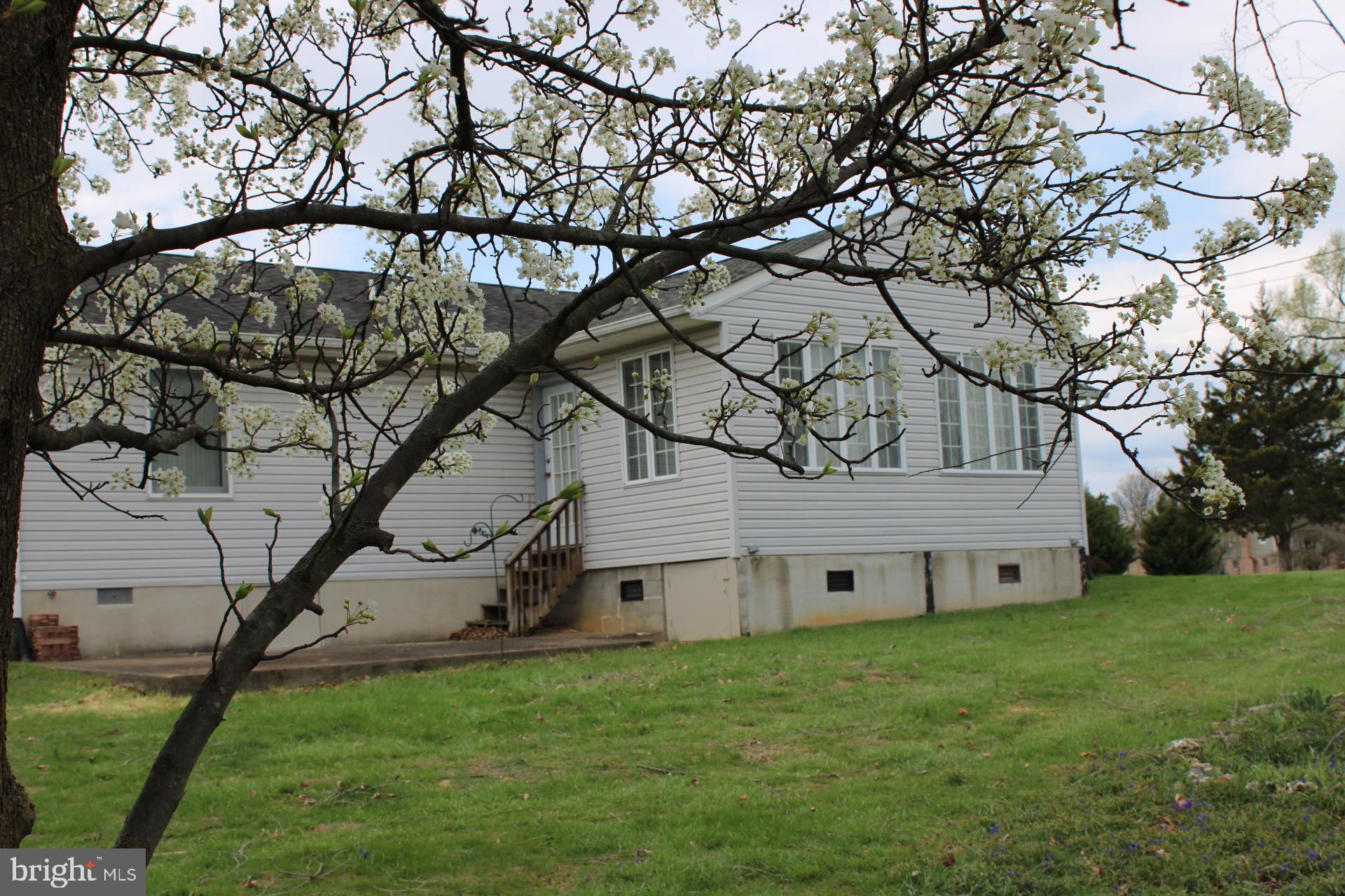 142 Braddock Boulevard Inwood, WV 25428 - Photo 32 of 36 a view of a house with a backyard