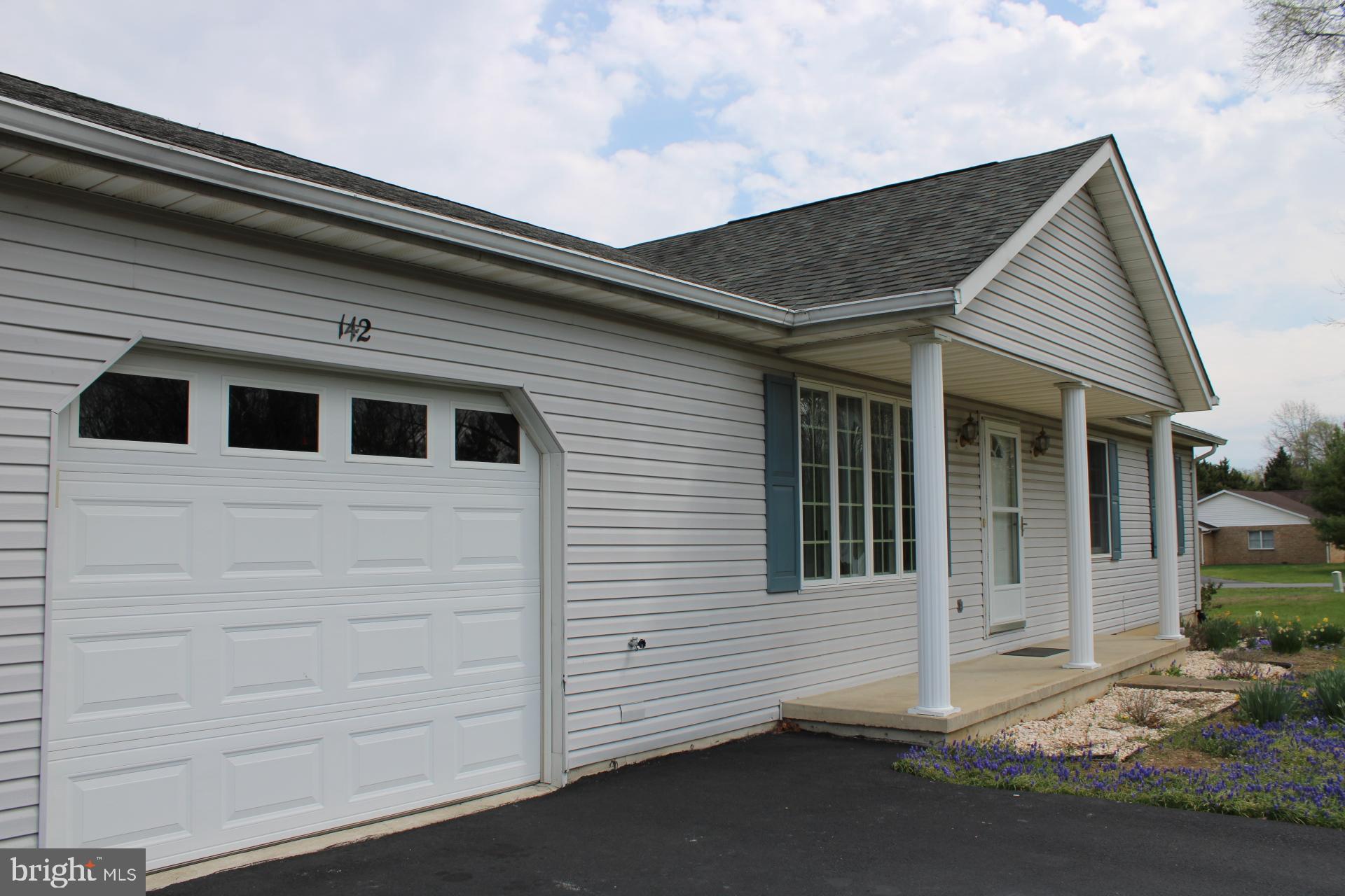 142 Braddock Boulevard Inwood, WV 25428 - Photo 5 of 36 a view of a house with a door