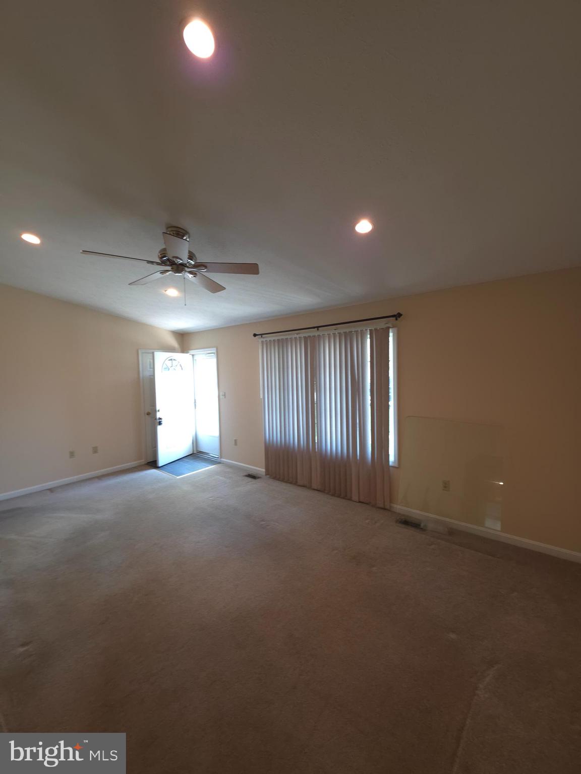 142 Braddock Boulevard Inwood, WV 25428 - Photo 8 of 36 a view of empty room with windows
