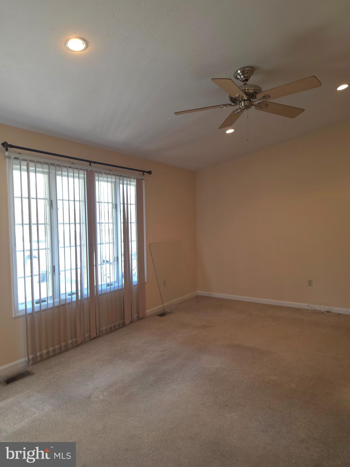 142 Braddock Boulevard Inwood, WV 25428 - Photo 10 of 36 a view of an empty room with a window