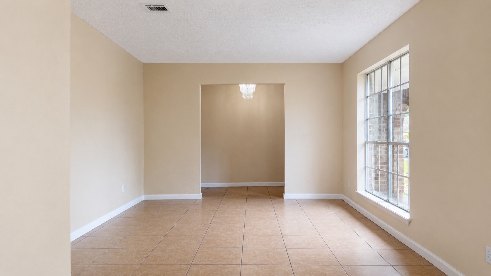 4418 Ponca Street Pasadena, TX 77504 - Photo 5 of 23 Bright front room with flexible space for dining, work, or a sitting area. (image has been enhance for marketing purposes)
