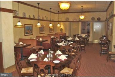 19355 Cypress Ridge Terrace, Unit 807 Leesburg, VA 20176 - Photo 7 of 29 a very nice looking dining room with chairs