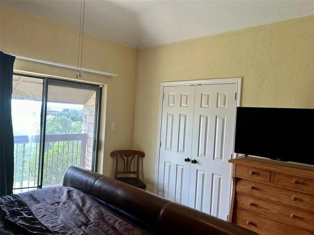 a bedroom with two beds and painted walls