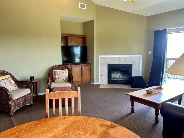 a bedroom with furniture and a fireplace