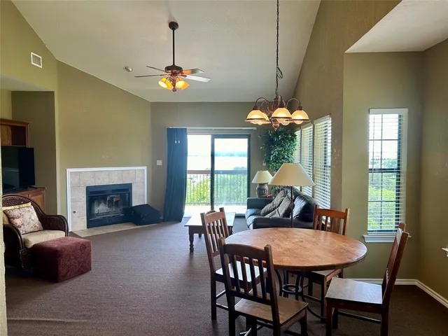 a view of a dining room with furniture window and fireplace