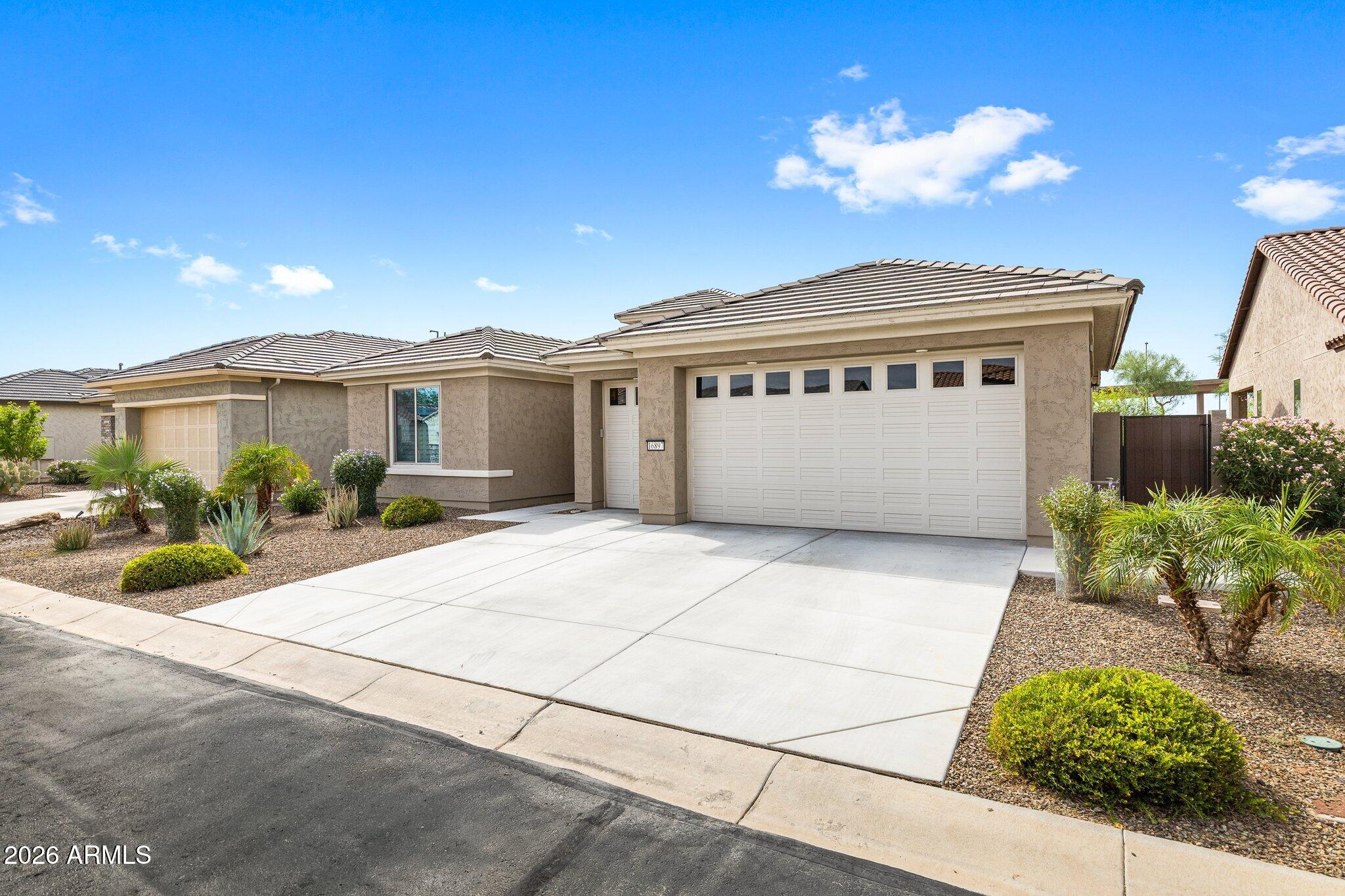 16897 West Almeria Road Goodyear, AZ 85395 - Photo 3 of 51 Spacious Three-Car Garage