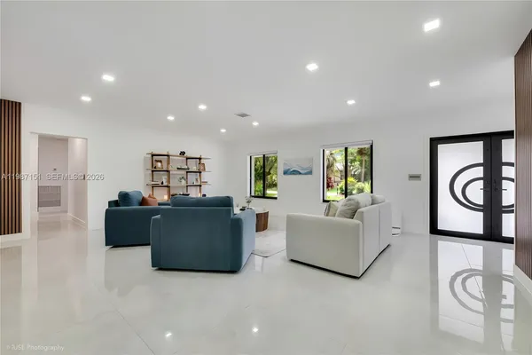 a living room with furniture and a window