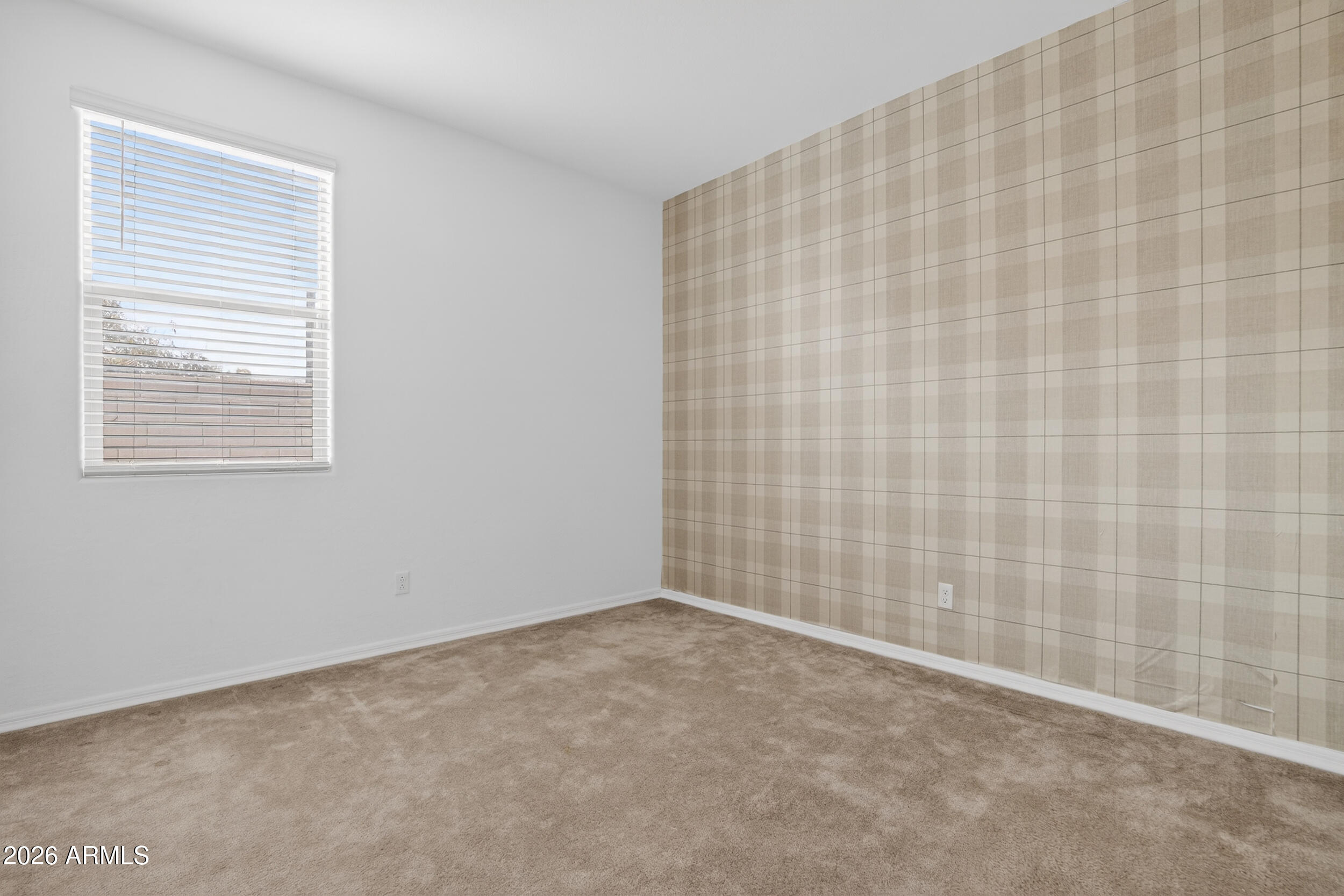 15177 West Desert Bloom Street Goodyear, AZ 85338 - Photo 41 of 55 a view of an empty room and a window