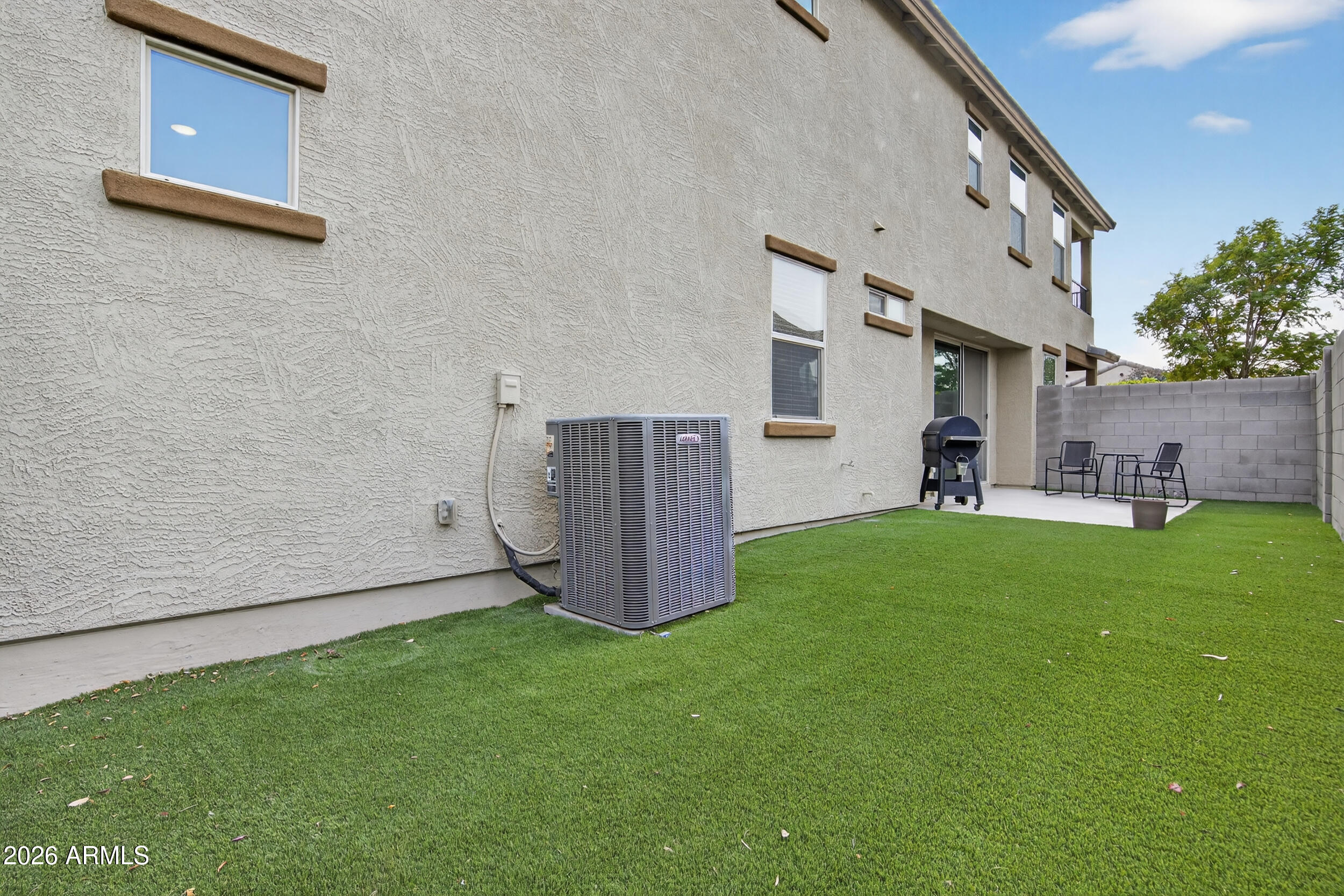 15177 West Desert Bloom Street Goodyear, AZ 85338 - Photo 50 of 55 a view of a backyard with a garden and plants