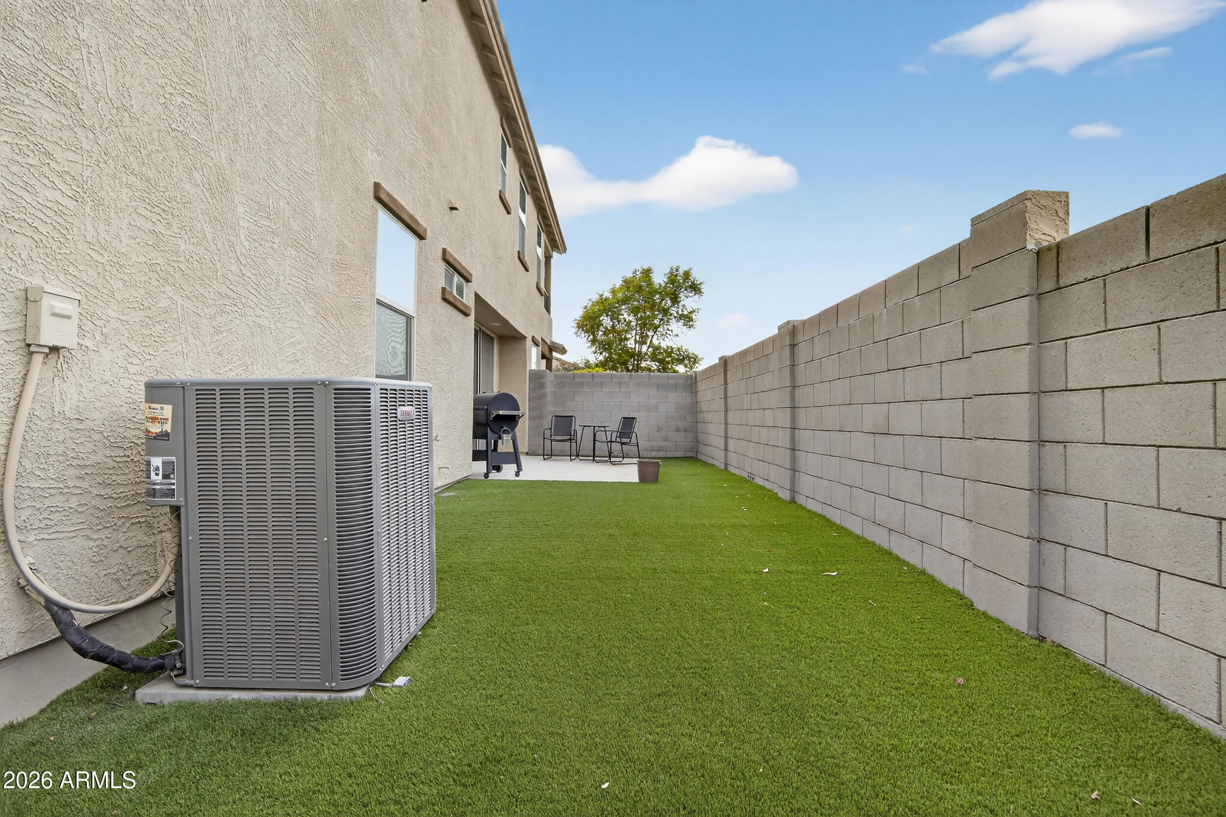 15177 West Desert Bloom Street Goodyear, AZ 85338 - Photo 51 of 55 a backyard of a house with lots of green space