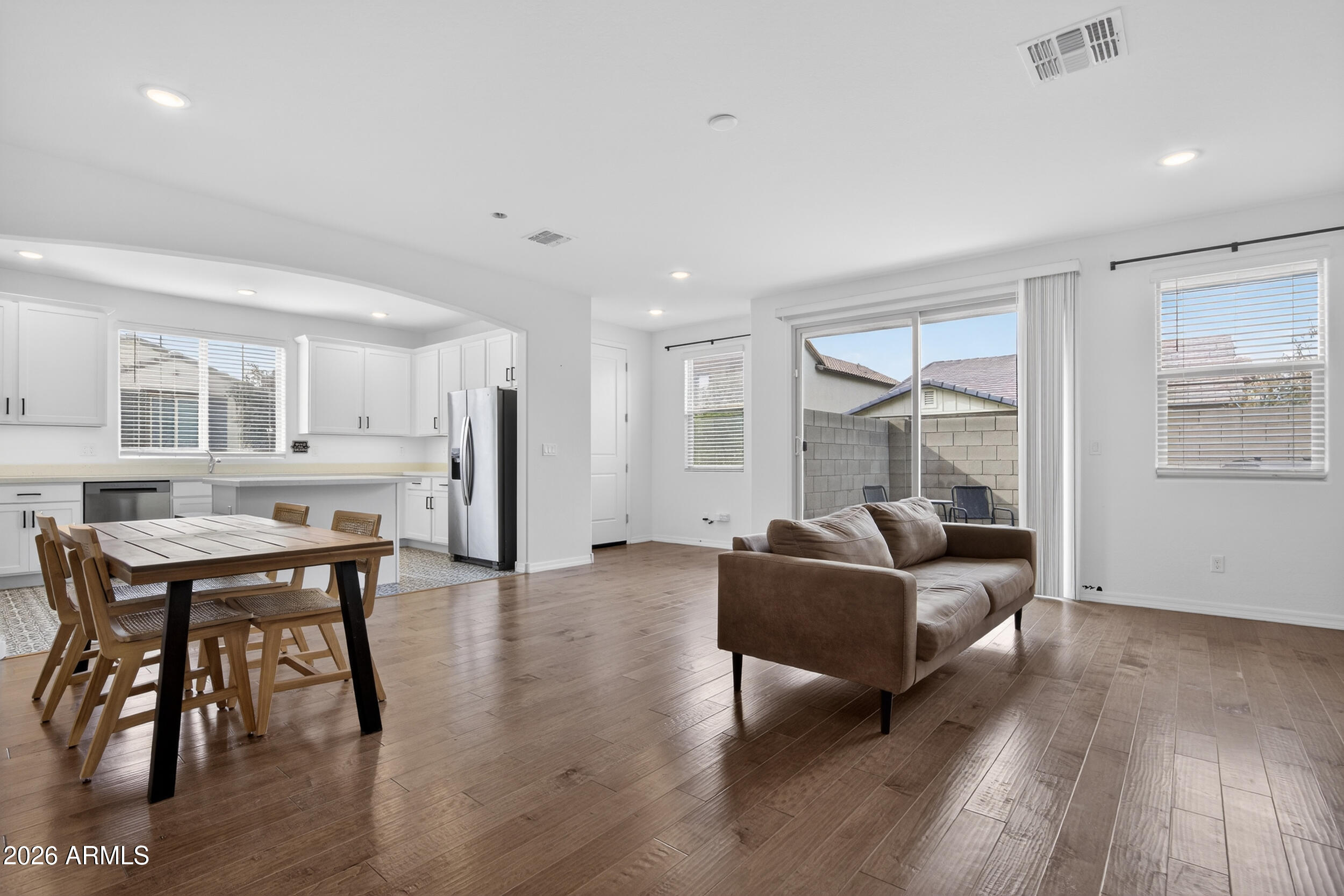 15177 West Desert Bloom Street Goodyear, AZ 85338 - Photo 8 of 55 a living room with furniture and a wooden floor