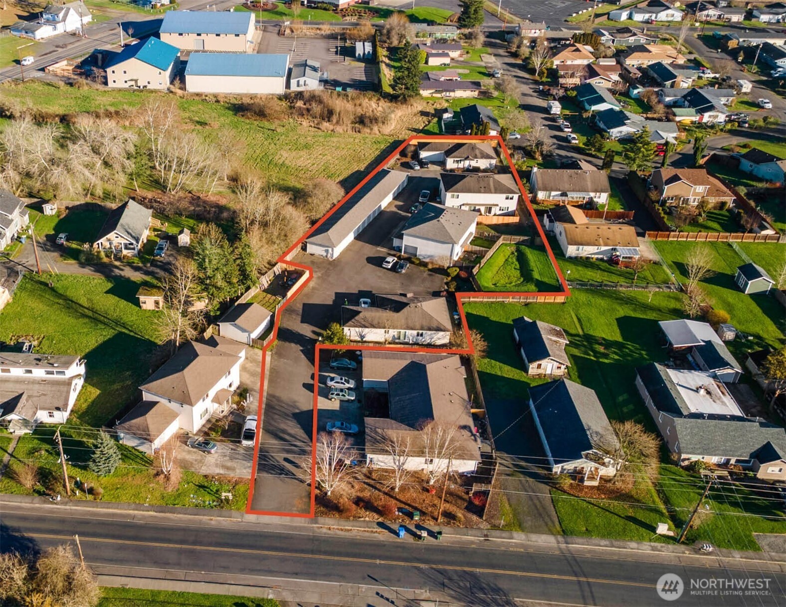 an aerial view of residential houses with outdoor space